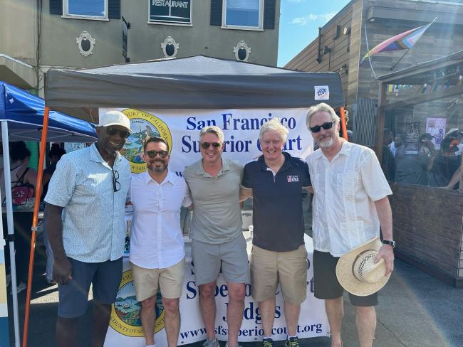 Judges answer questions at the Court's Castro Street Fair booth.