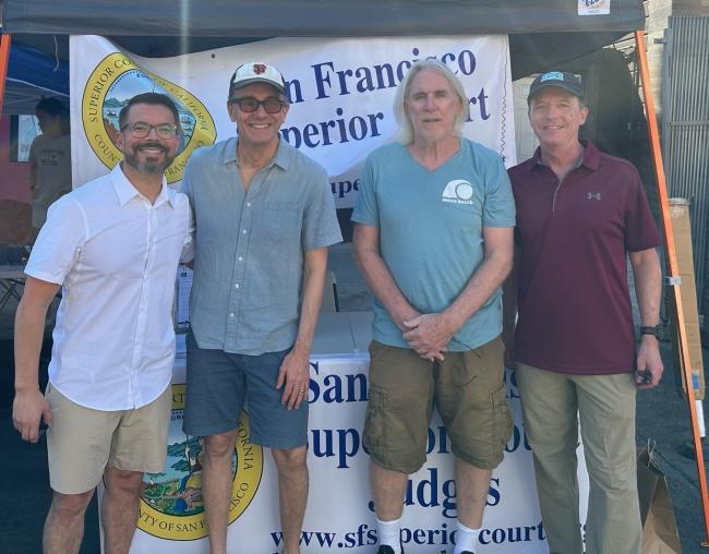 Judges answer questions at the Court's Castro Street Fair booth.