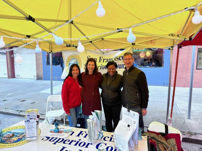 Judges answer questions at the Court's Castro Street Fair booth.