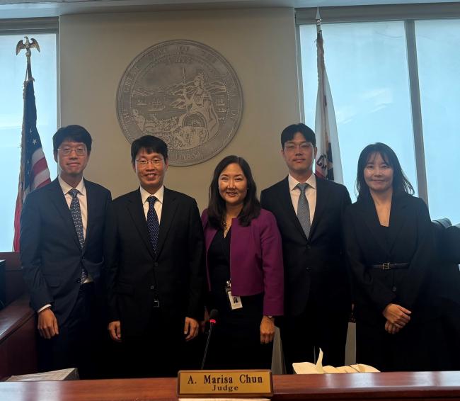 Judge A. Marisa Chun photographed with judges visiting from Korea. 